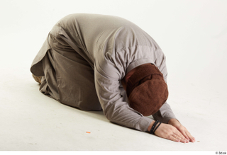 Luis Donovan Afgan Civil Praying kneeling praying whole body 0008.jpg